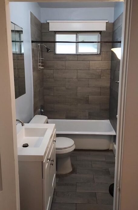 custom grey stone tile bathroom