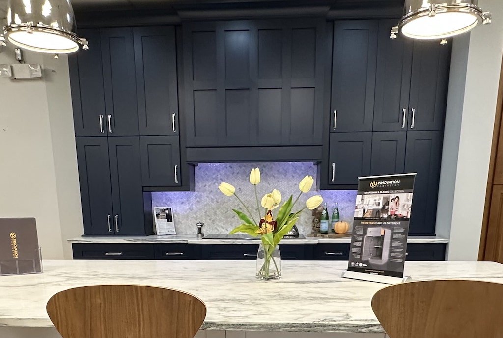 blue kitchen cabinets with stone island